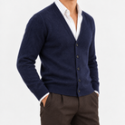 Fine knit cashmere v neck cardigan in navy, side view on a model