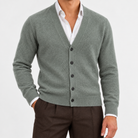 Fine knit cashmere v neck cardigan in sage green, front view on a model