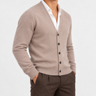 Fine knit cashmere v neck cardigan in taupe, side view on a model