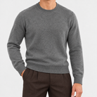Fine knit wool crew neck sweater in dark gray, front view on a model