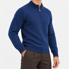 Fine knit wool quarter zip sweater in deep blue, side view on a model