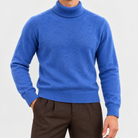 Fine knit wool turtleneck sweater in blue, front view on a model