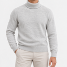 Fine knit wool turtleneck sweater in gray, front view on a model