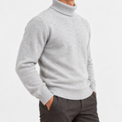 Fine knit wool turtleneck sweater in gray, side view on a model
