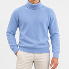 Fine knit wool turtleneck sweater in mist blue, front view on a model