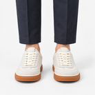 Leather low top sneakers with chunky gum soles in white, front view on a model