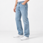 Light wash cotton blend straight jeans in light blue, side view on a model