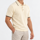Merino wool polo with contrast trim in cream, side view on a model