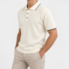 Merino wool polo with contrast trim in off white, side view on a model