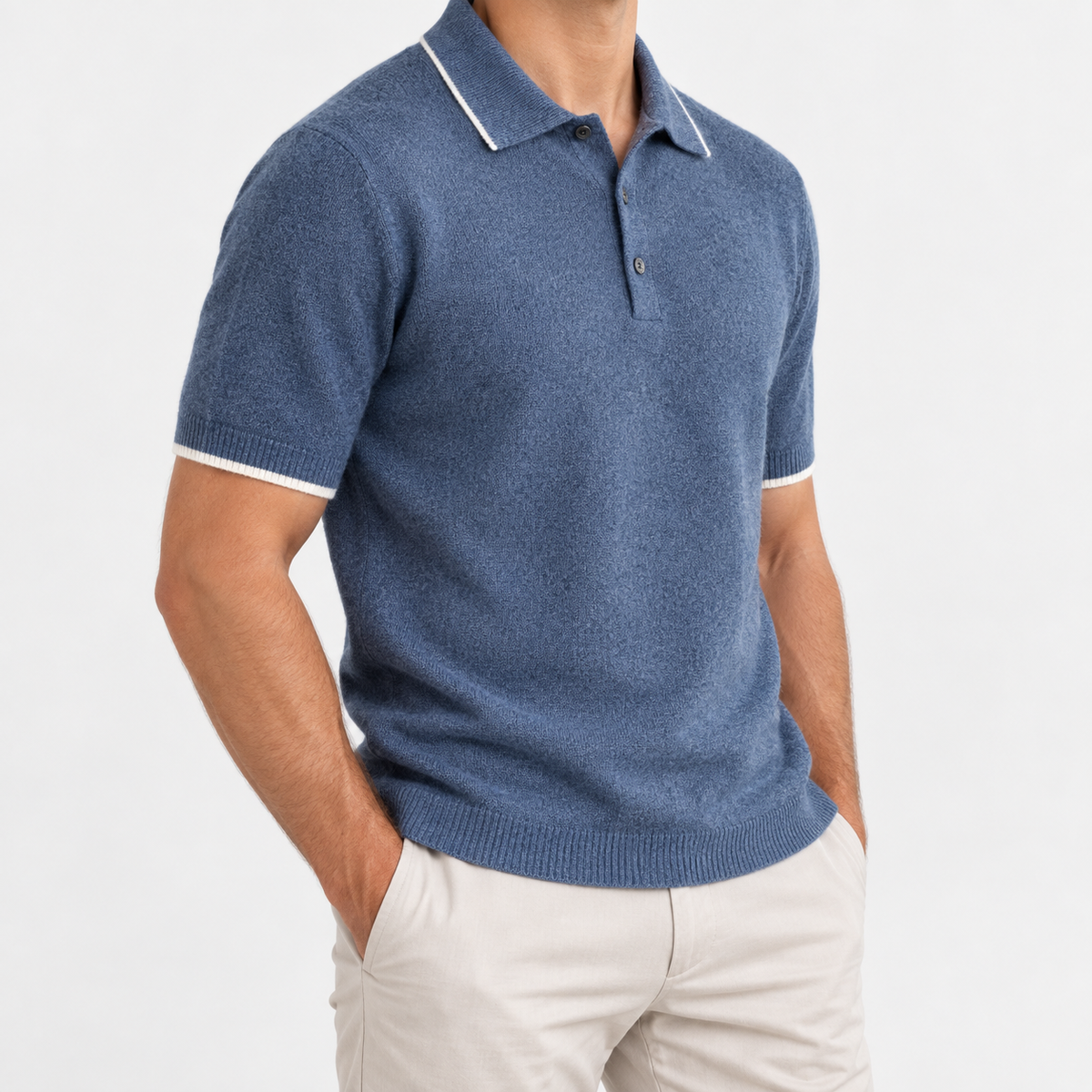 Merino wool polo with contrast trim in steel blue, side view on a model