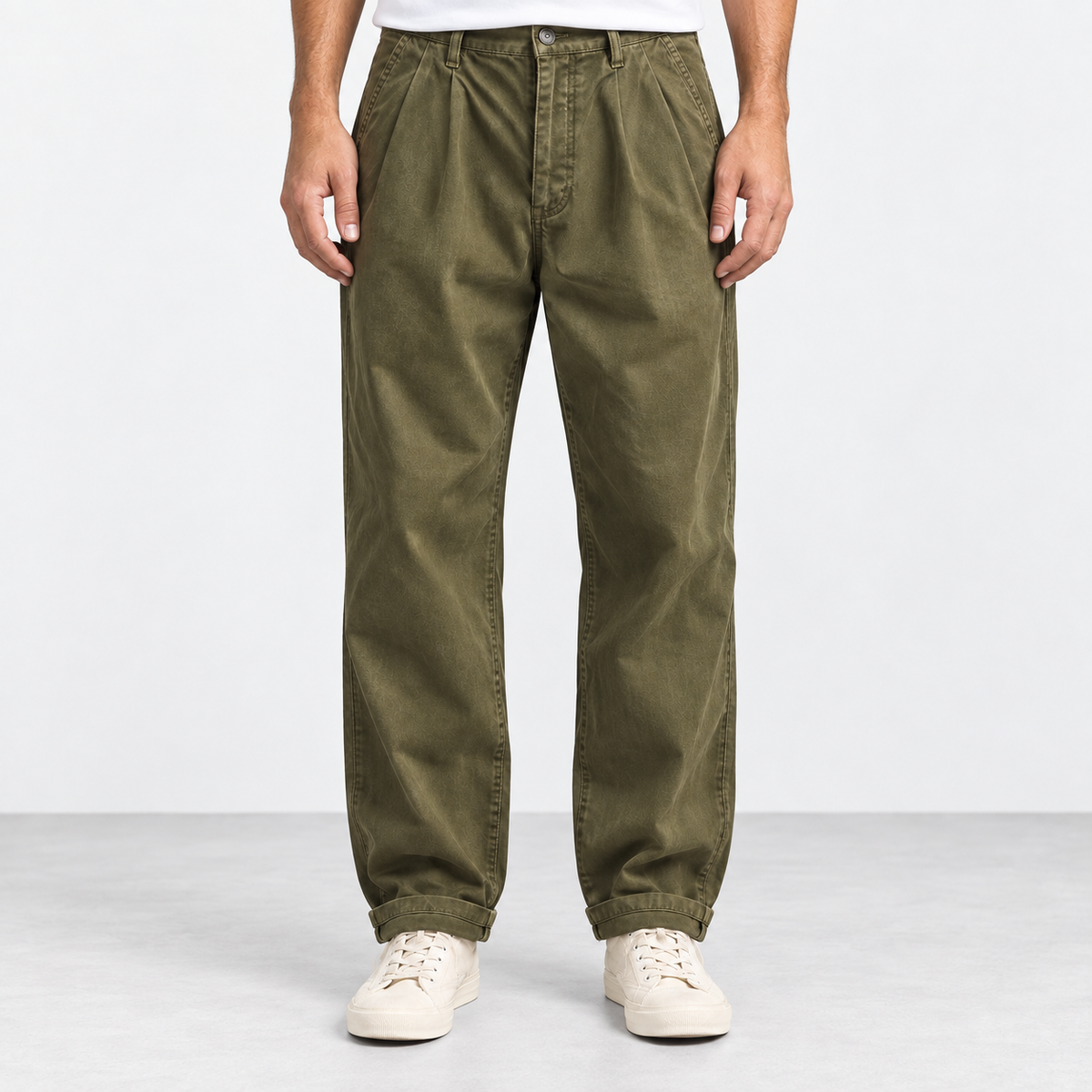 Pleated cotton utility trousers in army green, front view on a model