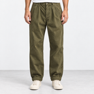 Pleated cotton utility trousers in army green, front view on a model