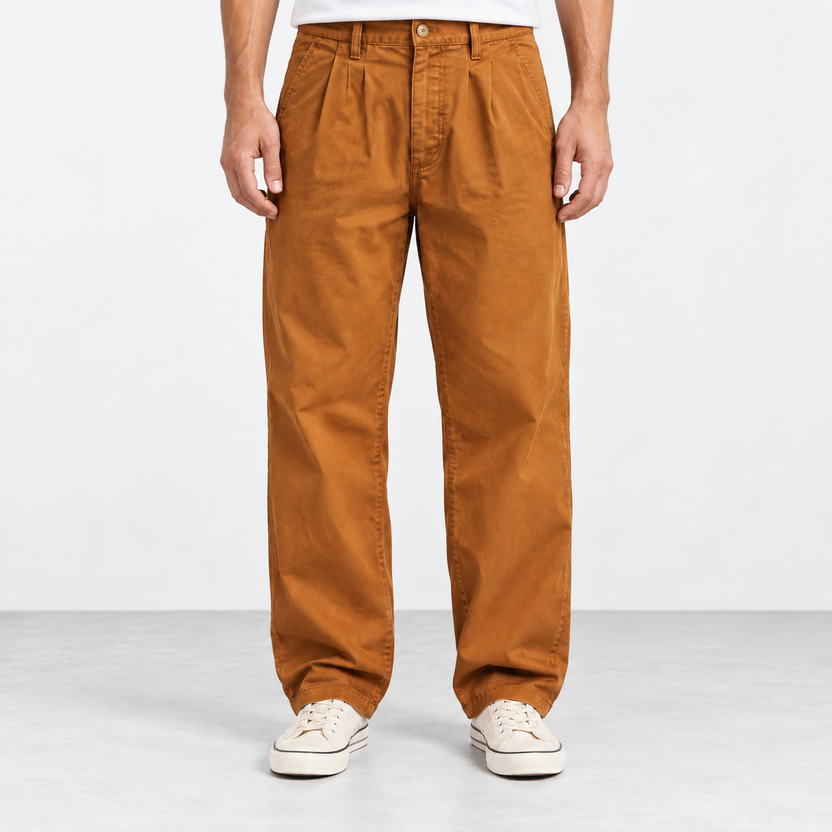 Pleated cotton utility trousers in ochre, front view on a model