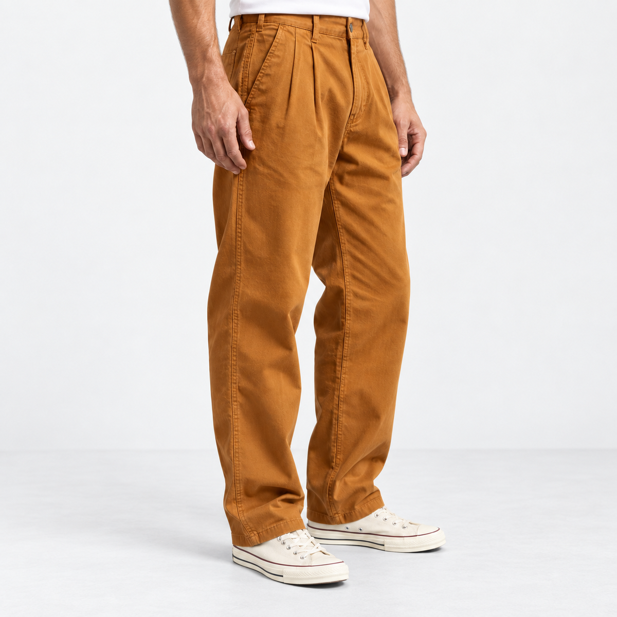 Pleated cotton utility trousers in ochre, side view on a model