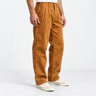 Pleated cotton utility trousers in ochre, side view on a model