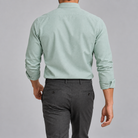 Ramon button-down shirt in green sage, back view on a model