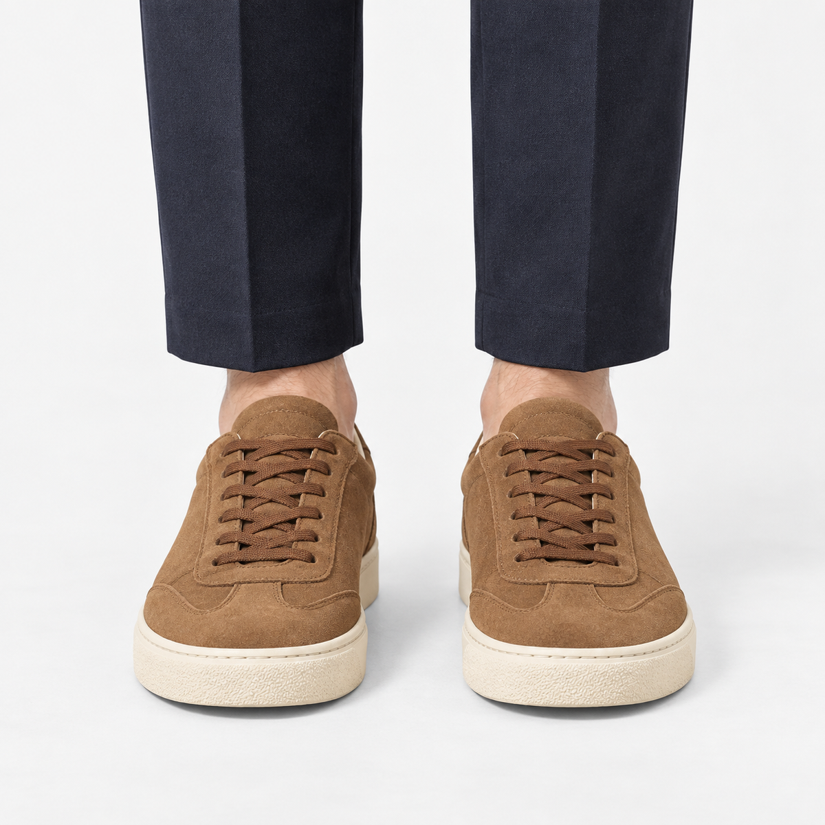 Retro low top sneakers with contrast soles in brown, front view on a model