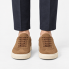 Retro low top sneakers with contrast soles in brown, front view on a model