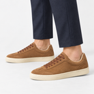 Retro low top sneakers with contrast soles in brown, side view on a model