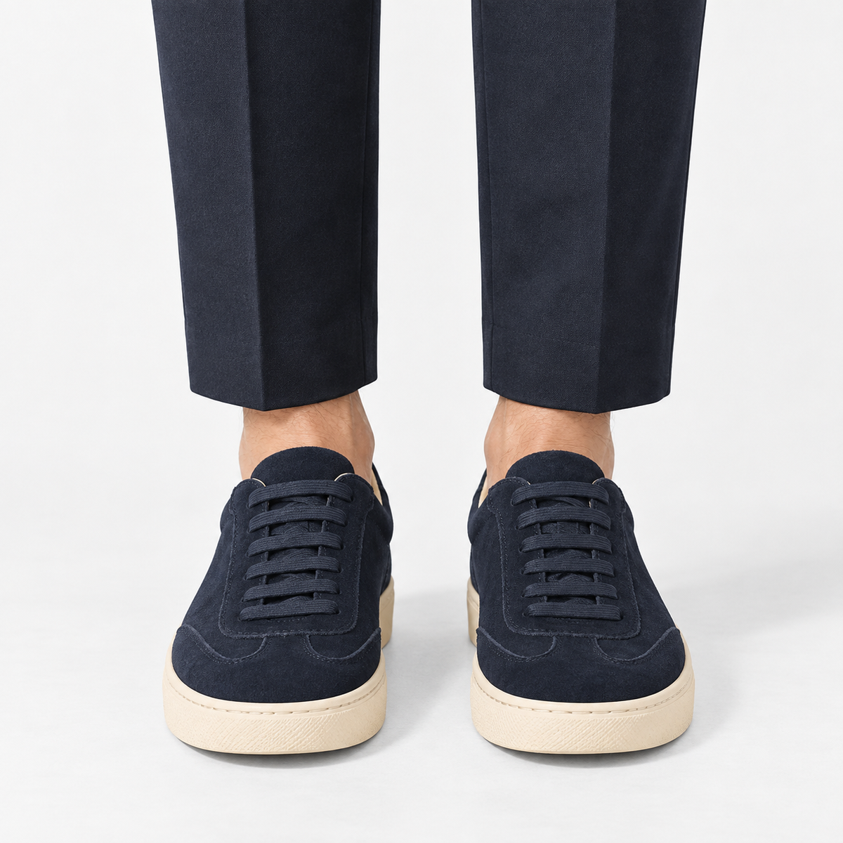 Retro low top sneakers with contrast soles in navy, front view on a model