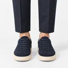 Retro low top sneakers with contrast soles in navy, front view on a model