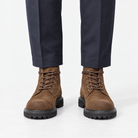 Rough suede lace up ankle boots in brown standard, front view on a model