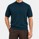 Short sleeve wool mock neck top in petrol blue, front view on a model