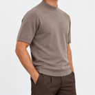Short sleeve wool mock neck top in taupe, side view on a model