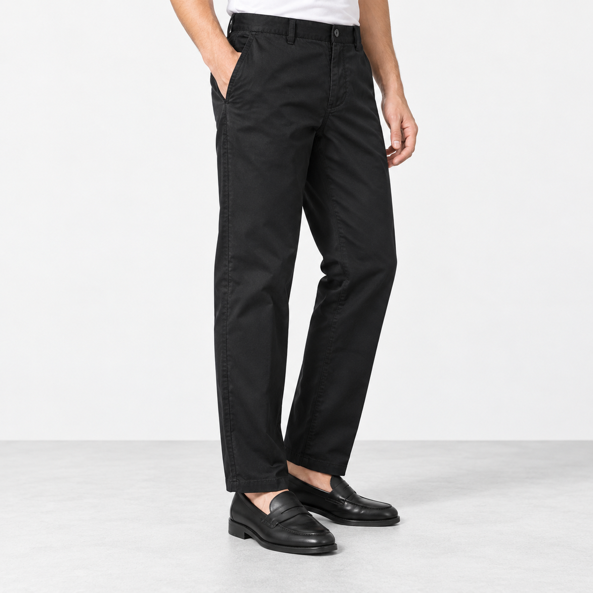 Straight leg cotton utility trousers in black, side view on a model