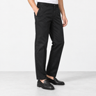 Straight leg cotton utility trousers in black, side view on a model