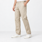 Straight leg cotton utility trousers in light khaki, side view on a model