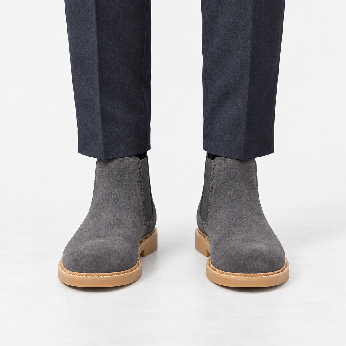 Suede finish leather chelsea boots in gray, front view on a model