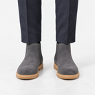 Suede finish leather chelsea boots in gray, front view on a model