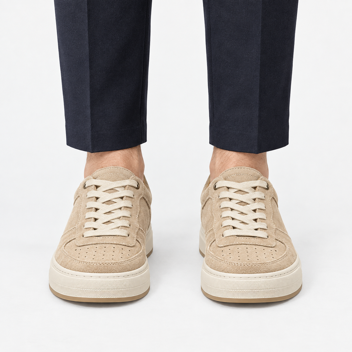 Suede panel low top sneakers in beige, front view on a model