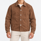 Washed cotton chore jacket in tobacco brown, front view on a model