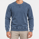 Washed cotton crew neck sweatshirt in washed blue, front view on a model
