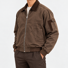 Washed cotton zip jacket with corduroy collar in brown, side view on a model