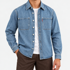 Washed denim twin pocket shirt in denim blue, front view on a model