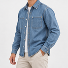 Washed denim twin pocket shirt in denim blue, side view on a model
